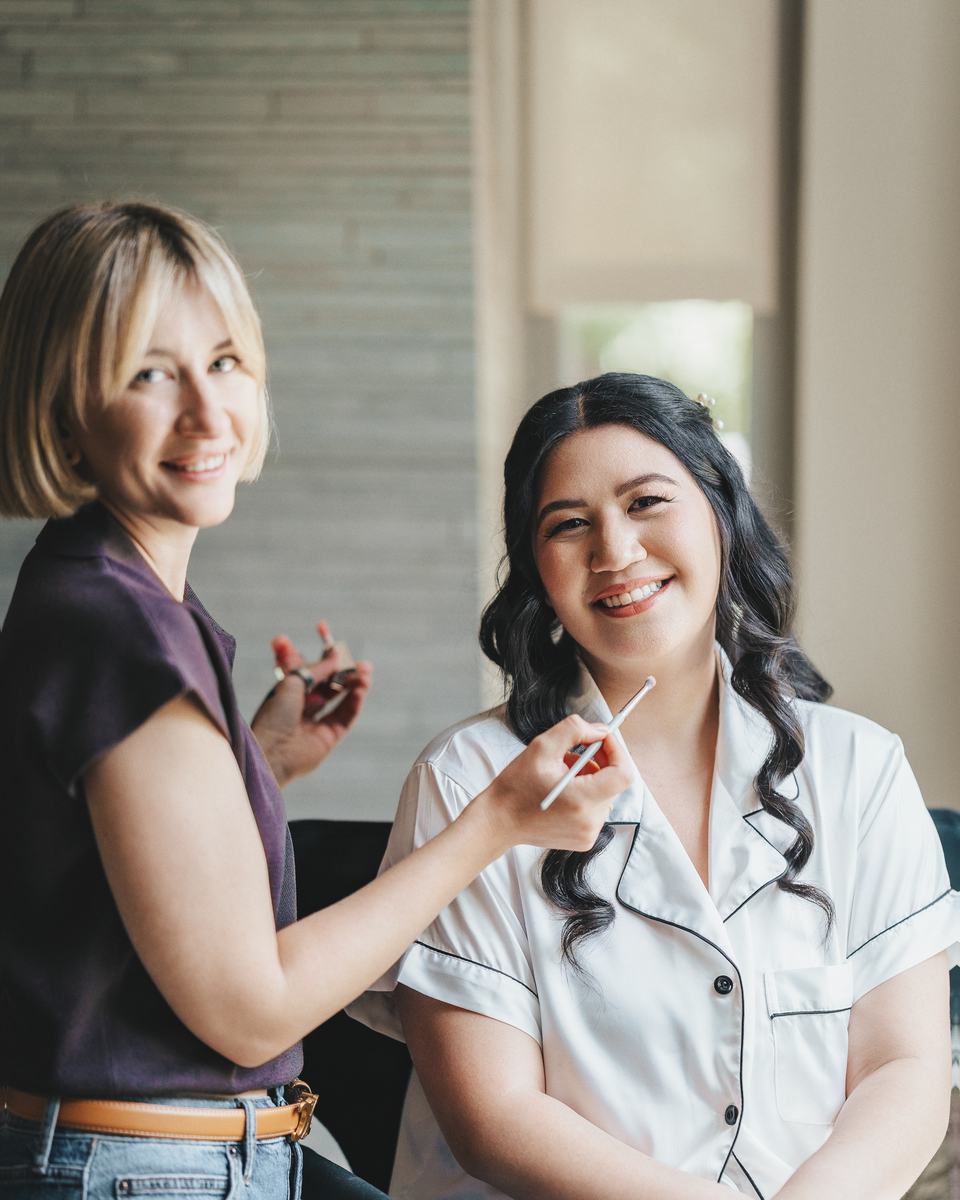 A Blossom Beauty Team artist getting a bride ready on the wedding morning